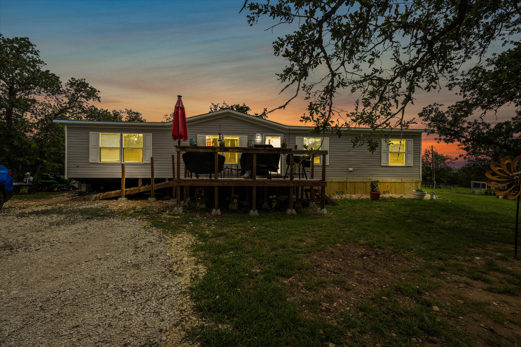 2755 Washburn Road Luling, TX 78648 - Photo 2 of 40 A welcoming front deck and gravel driveway complement this inviting house #1.