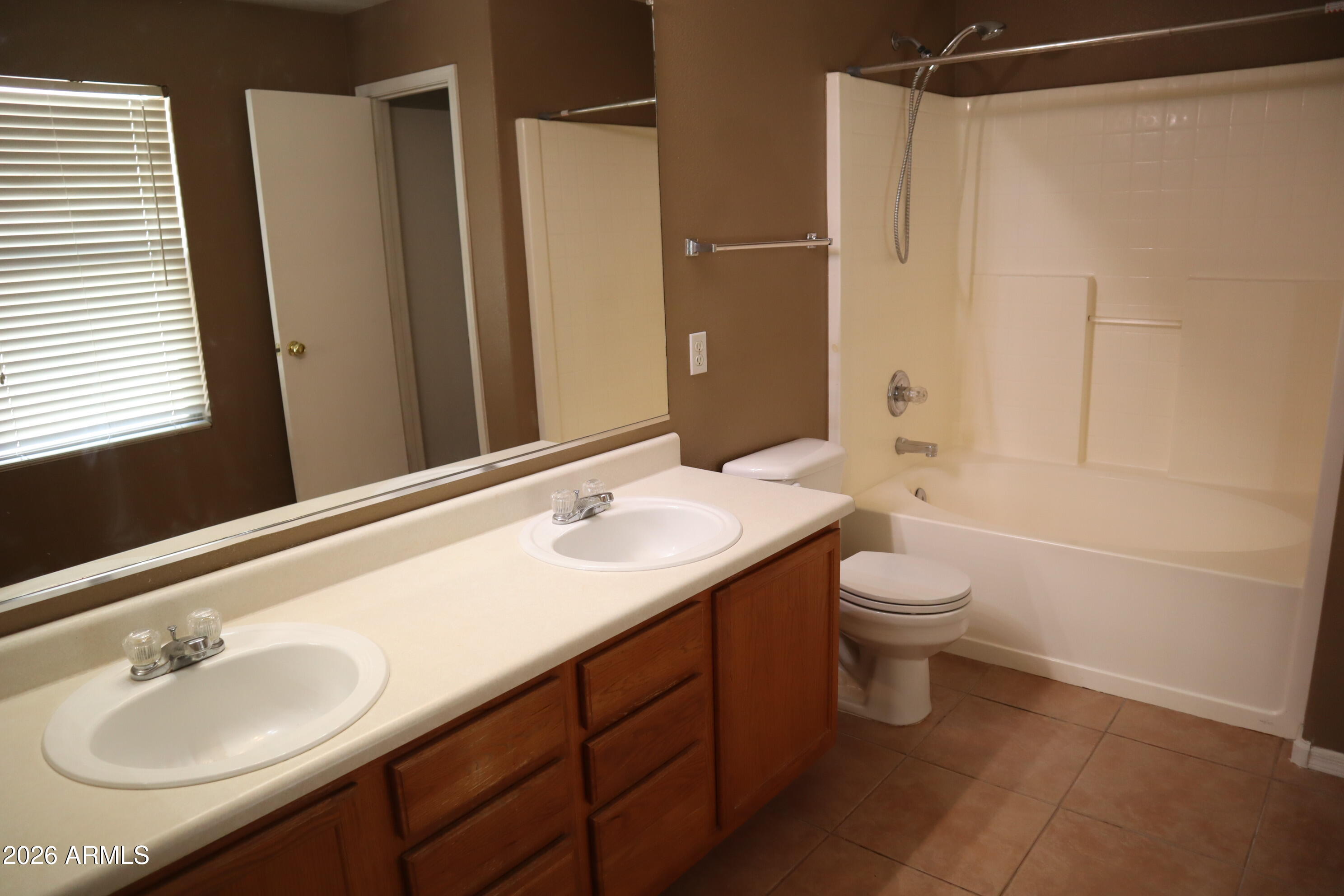 3281 South Martingale Road Gilbert, AZ 85297 - Photo 11 of 15 a bathroom with a sink toilet and shower