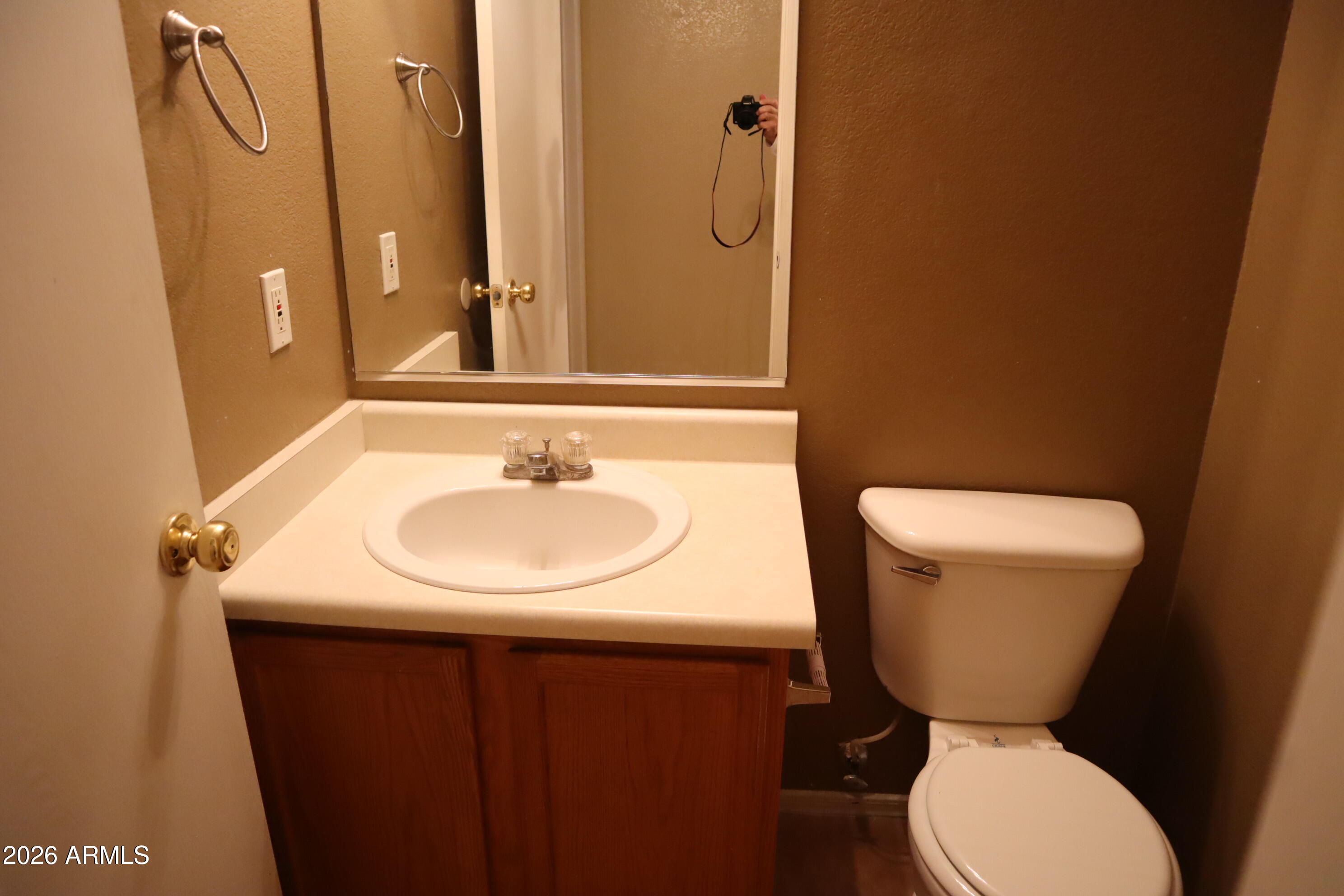 3281 South Martingale Road Gilbert, AZ 85297 - Photo 12 of 15 a bathroom with a sink toilet and mirror