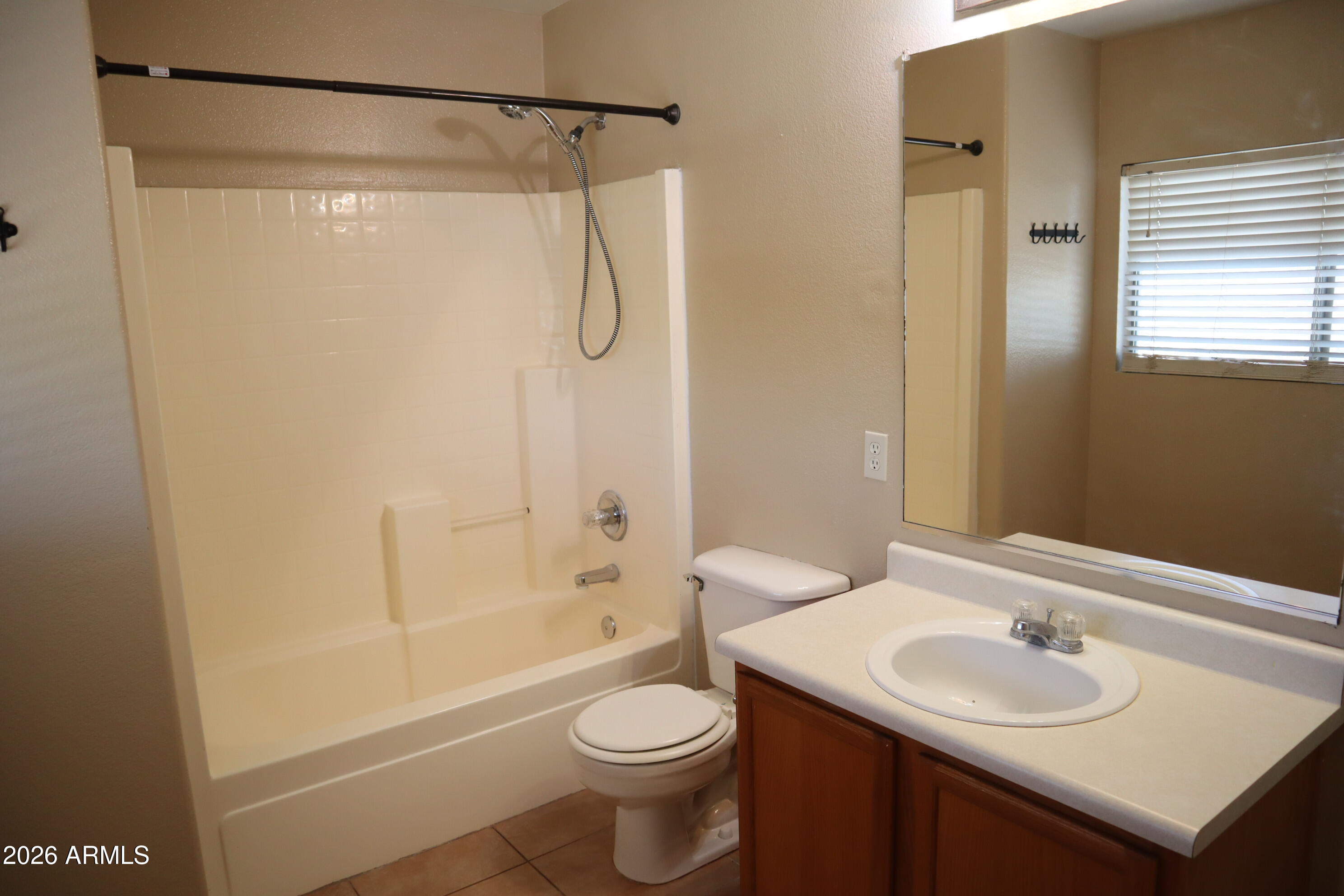 3281 South Martingale Road Gilbert, AZ 85297 - Photo 13 of 15 a bathroom with a sink toilet and shower