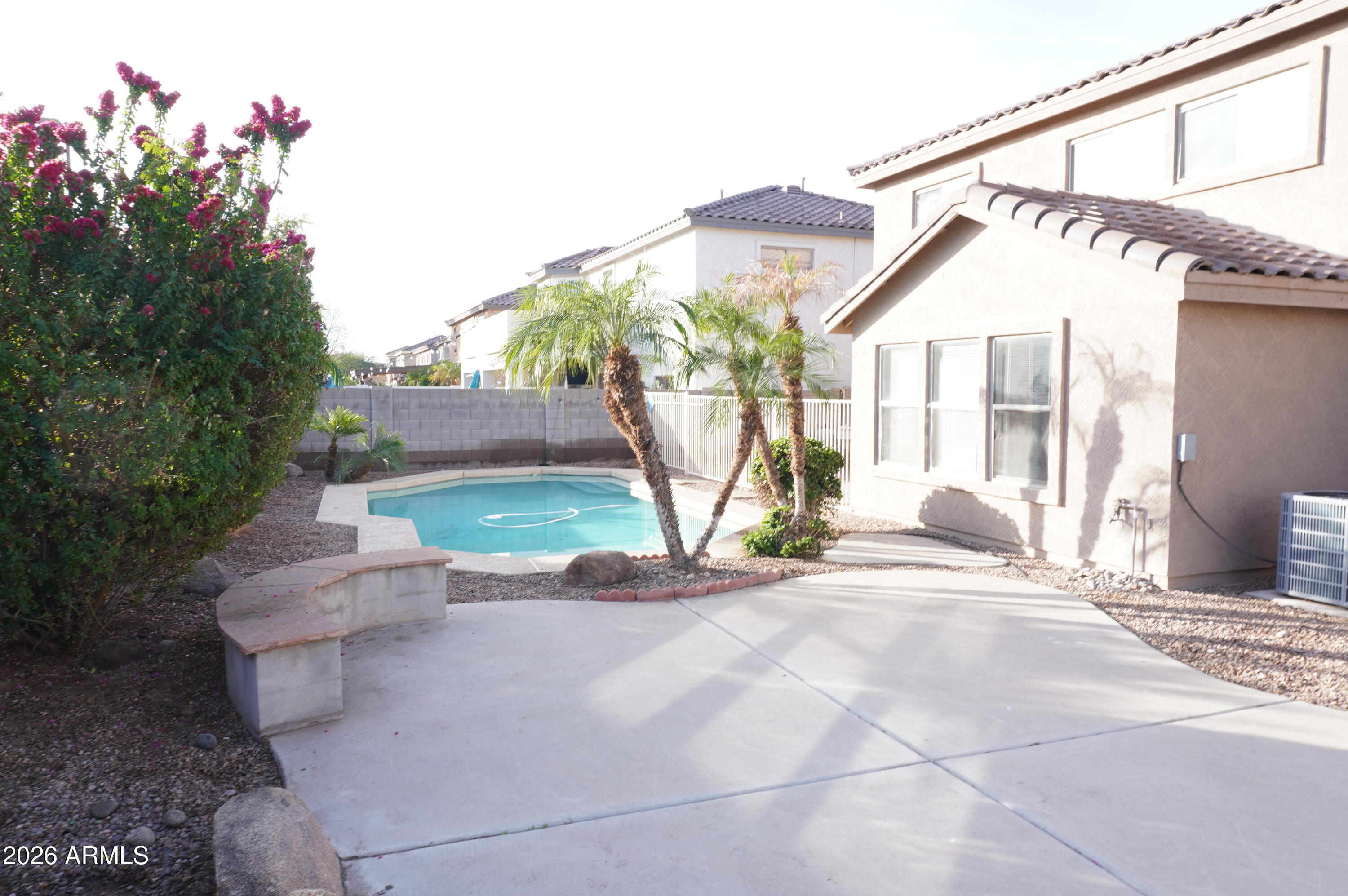 3281 South Martingale Road Gilbert, AZ 85297 - Photo 4 of 15 a view of a house with a yard and potted plants