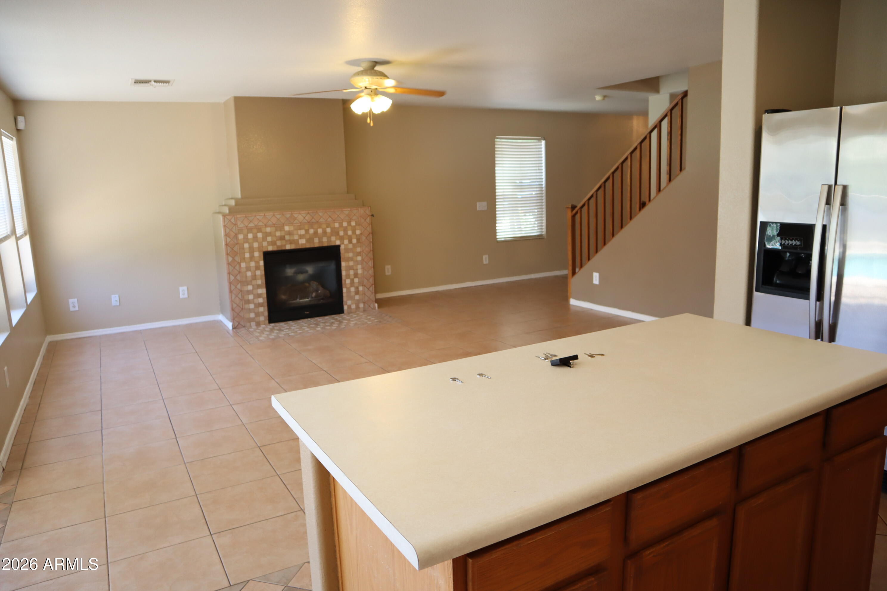 3281 South Martingale Road Gilbert, AZ 85297 - Photo 9 of 15 a view of a kitchen with furniture and a fireplace