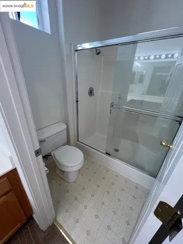 a bathroom with a double vanity sink and a toilet