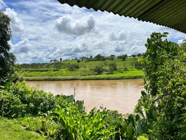 a view of a lake with a house in the background