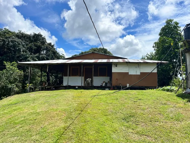 a front view of a house with yard and porch