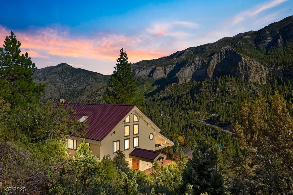 Unique + tranquil, 5-bd, 4-bath mountain home with ample space, captivating design + VIEWS!