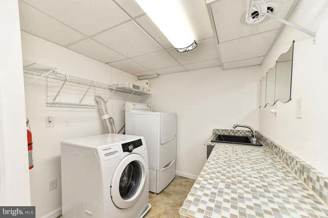 5918 Atteentee Road Springfield, VA 22150 - Photo 21 of 25 a utility room with dryer and washer