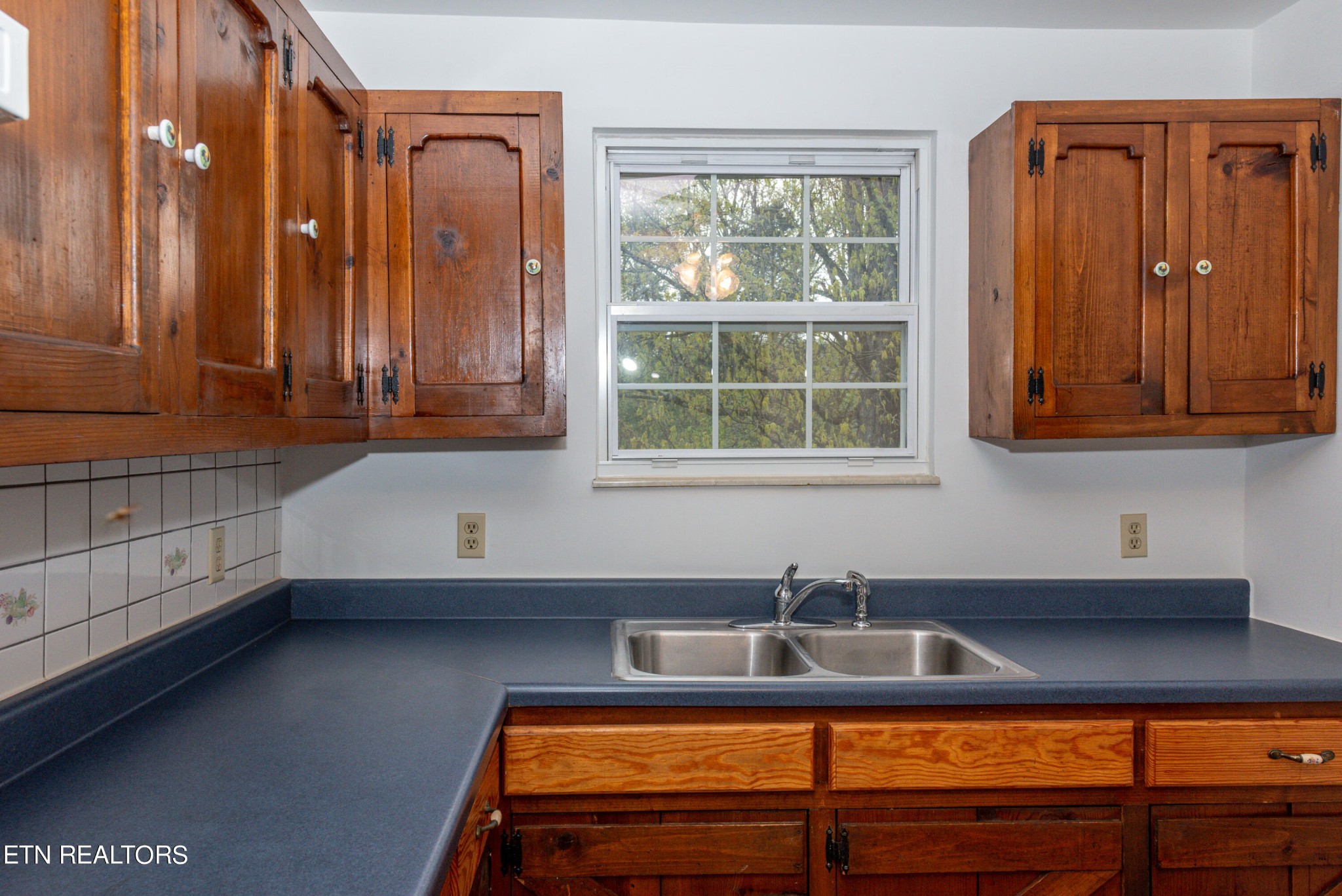 4038 Big Springs Ridge Road Friendsville, TN 37737 - Photo 11 of 26 a bathroom with a sink and a mirror