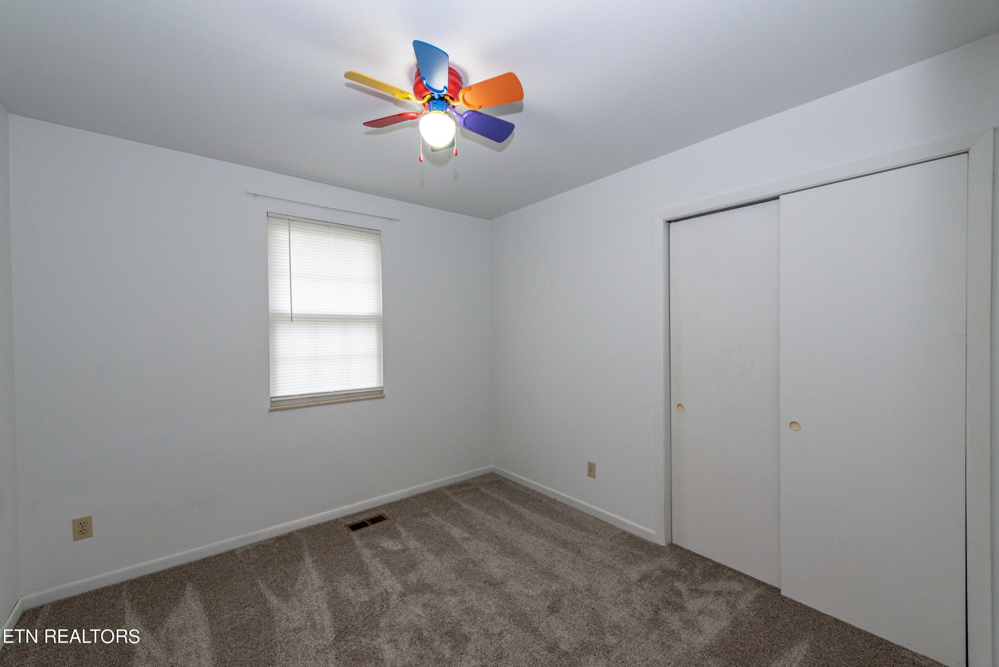 4038 Big Springs Ridge Road Friendsville, TN 37737 - Photo 12 of 26 an empty room with window and wall painting
