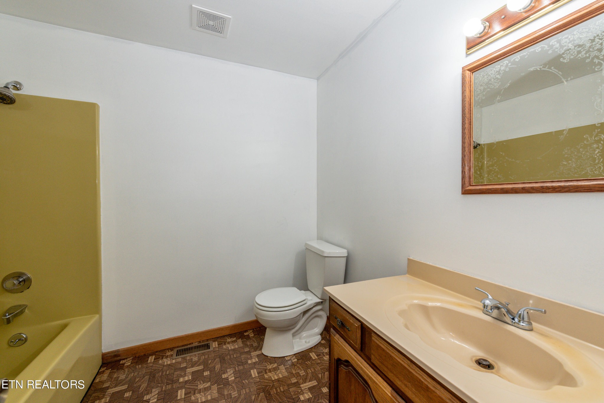 4038 Big Springs Ridge Road Friendsville, TN 37737 - Photo 14 of 26 a bathroom with a sink and a toilet