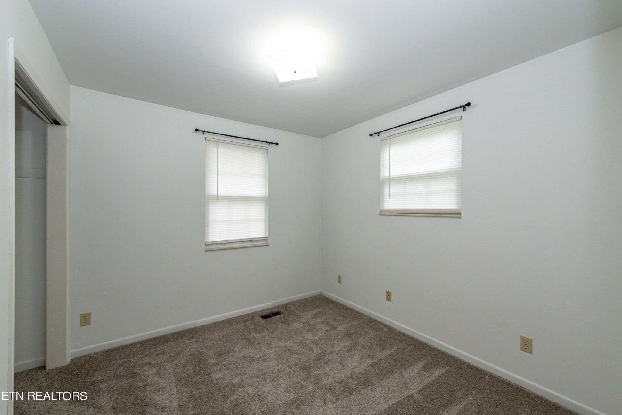 4038 Big Springs Ridge Road Friendsville, TN 37737 - Photo 16 of 26 an empty room with a window