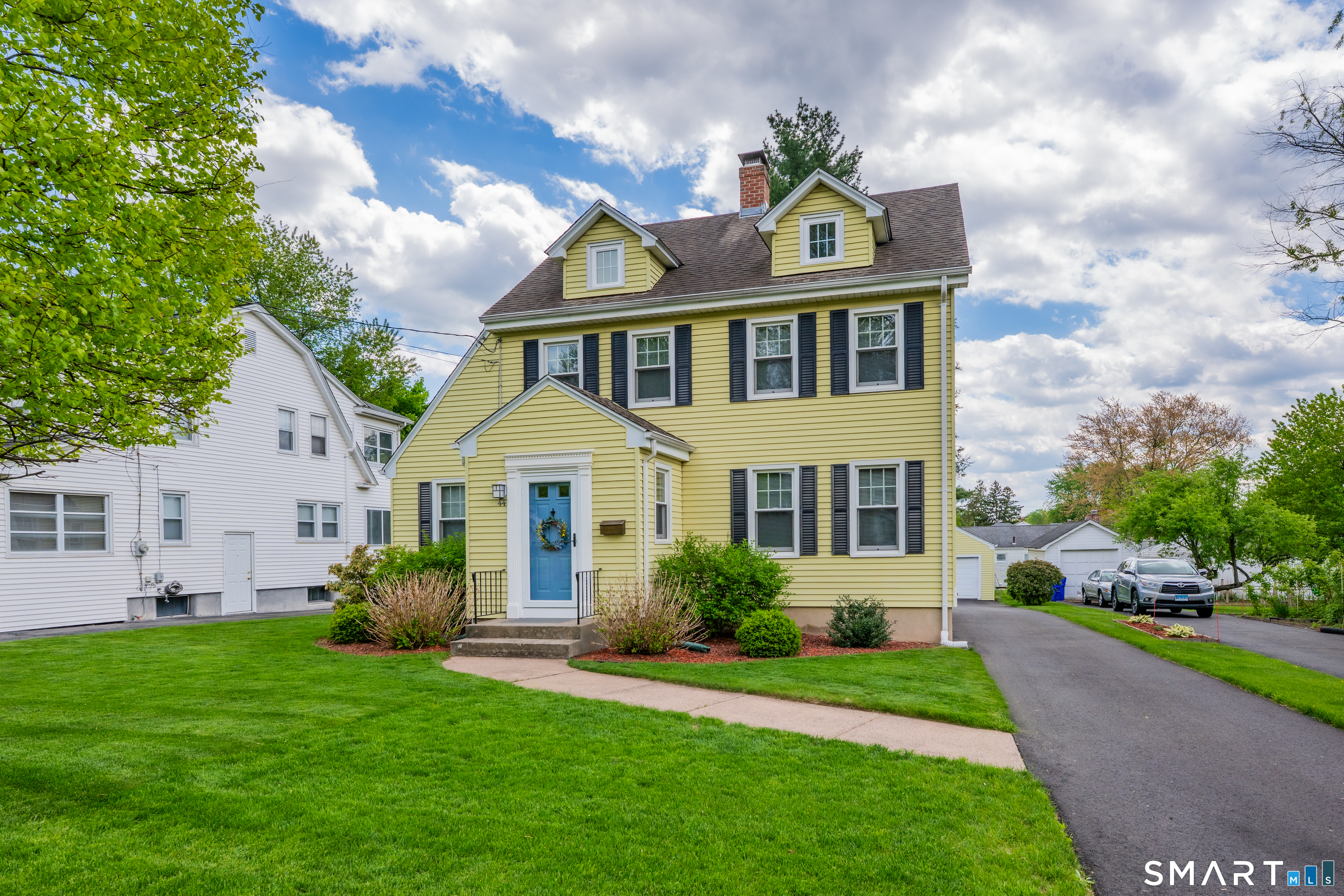 44 Beverly Road Wethersfield, CT 06109 - Photo 2 of 31 a front view of a house with a garden