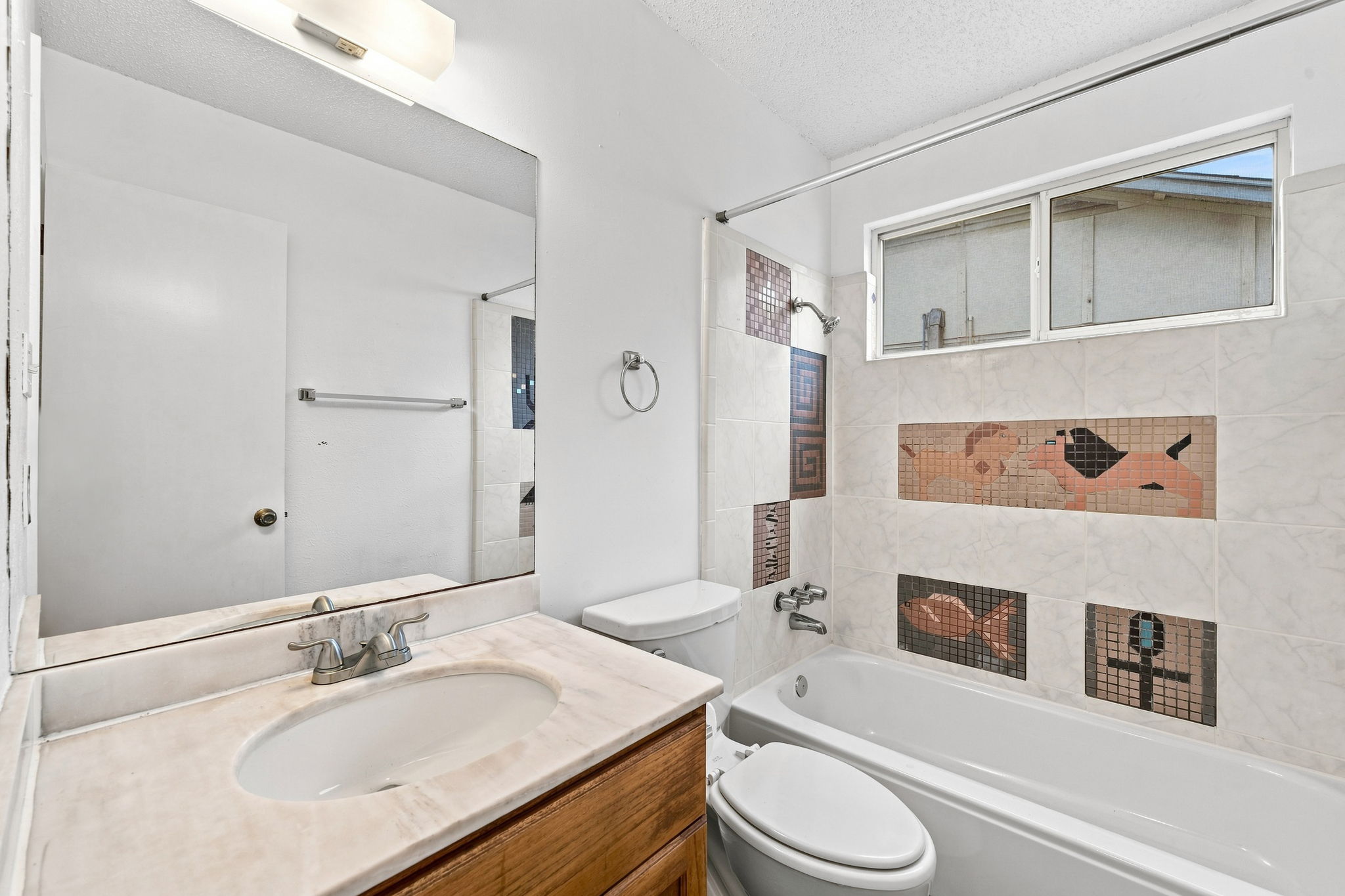 6712 Ripple Run Austin, TX 78744 - Photo 21 of 31 Artistic mosaic tile in bathroom
