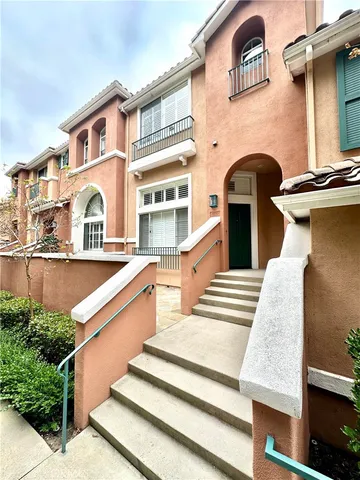 a front view of a house with large windows
