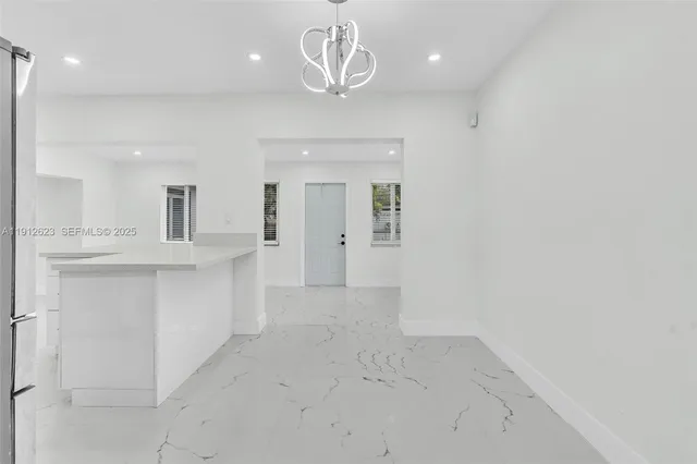 a view of a kitchen with a sink