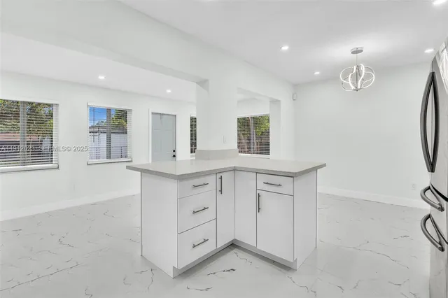 a bathroom with a sink vanity and a mirror
