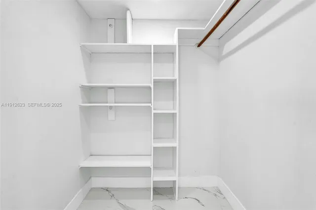 a view of an empty walk in closet