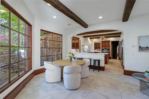 a spacious bedroom with a bed and a fireplace