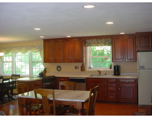 31 Old Stage Road Chelmsford, MA 01824 - Photo 3 of 5 a kitchen with granite countertop a sink a stove a counter space and cabinets