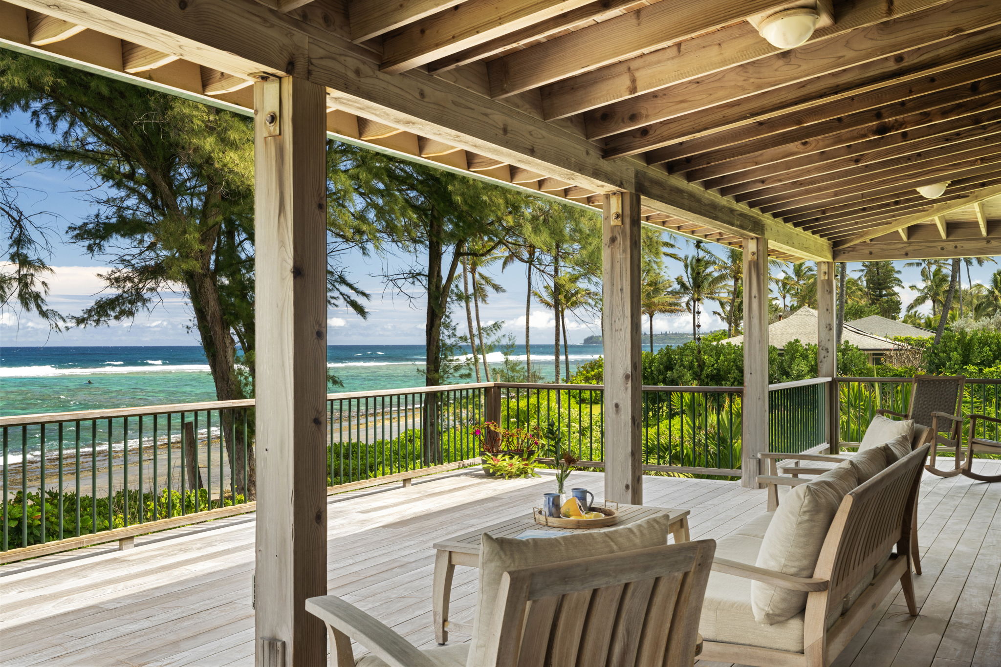 7312 Alealea Road Hanalei, HI 96714 - Photo 10 of 30 a view of a patio with a table chairs and wooden floor