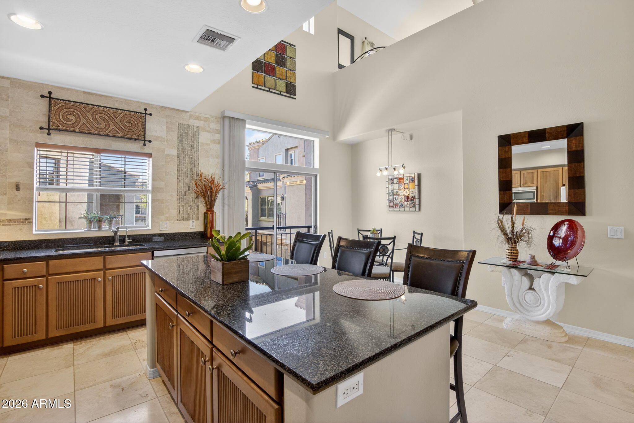 3935 East Rough Rider Road, Unit 1145 Phoenix, AZ 85050 - Photo 8 of 32 a kitchen with a counter top space and windows