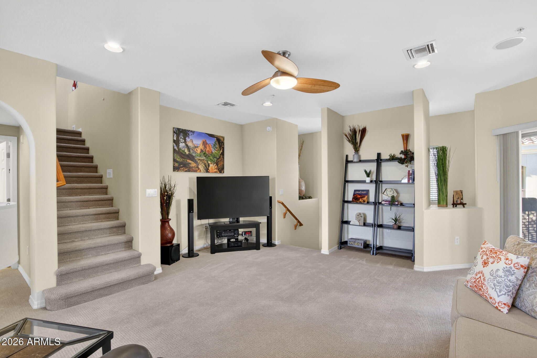 3935 East Rough Rider Road, Unit 1145 Phoenix, AZ 85050 - Photo 11 of 32 a view of a livingroom with furniture and a flat screen tv