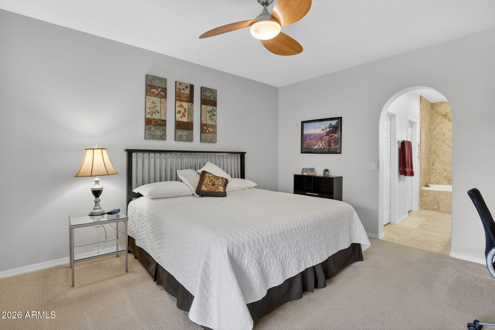 3935 East Rough Rider Road, Unit 1145 Phoenix, AZ 85050 - Photo 12 of 32 a bedroom with bed and window