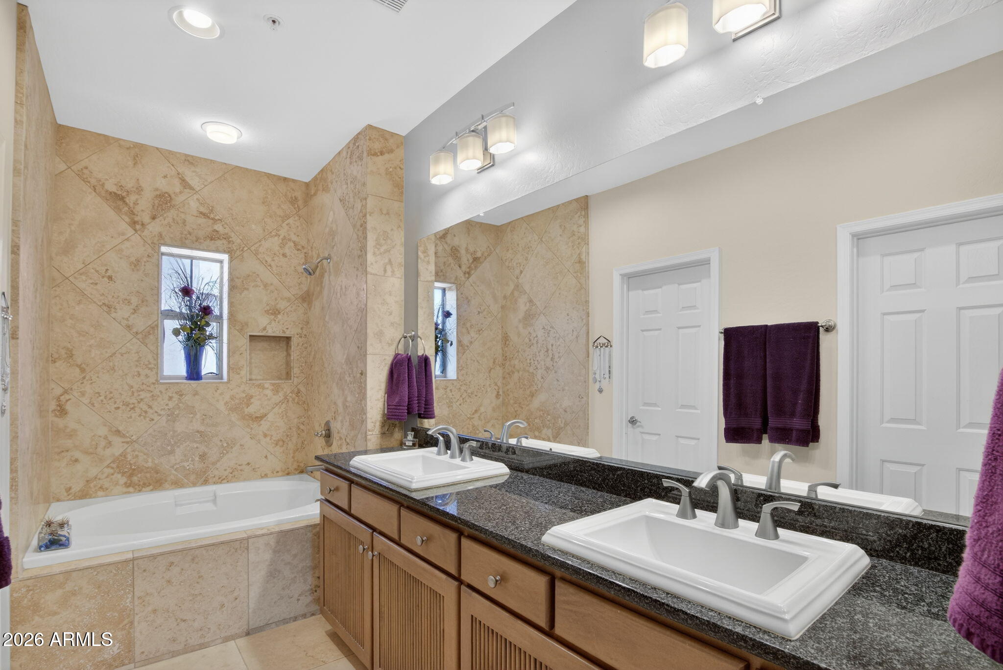 3935 East Rough Rider Road, Unit 1145 Phoenix, AZ 85050 - Photo 15 of 32 a bathroom with a bathtub double sink and mirror