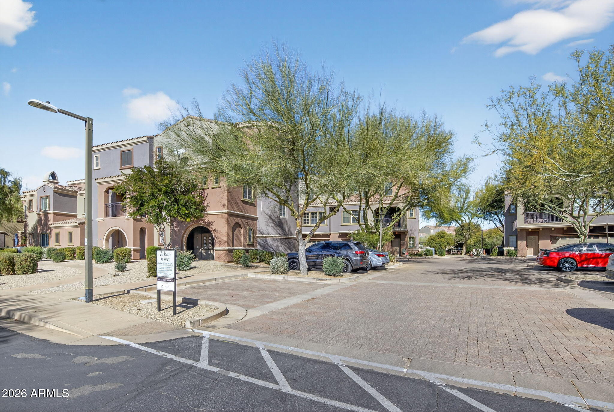 3935 East Rough Rider Road, Unit 1145 Phoenix, AZ 85050 - Photo 26 of 32 a view of street with cars