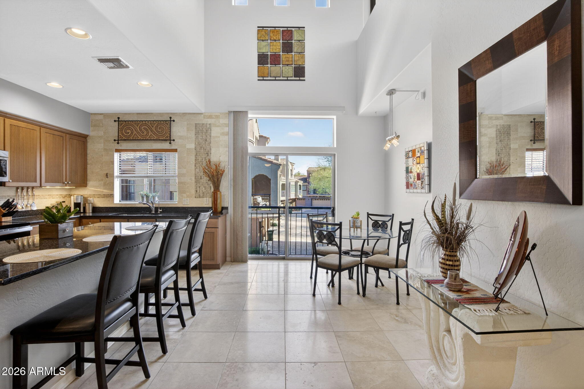 3935 East Rough Rider Road, Unit 1145 Phoenix, AZ 85050 - Photo 6 of 32 a dining room with furniture and wooden floor