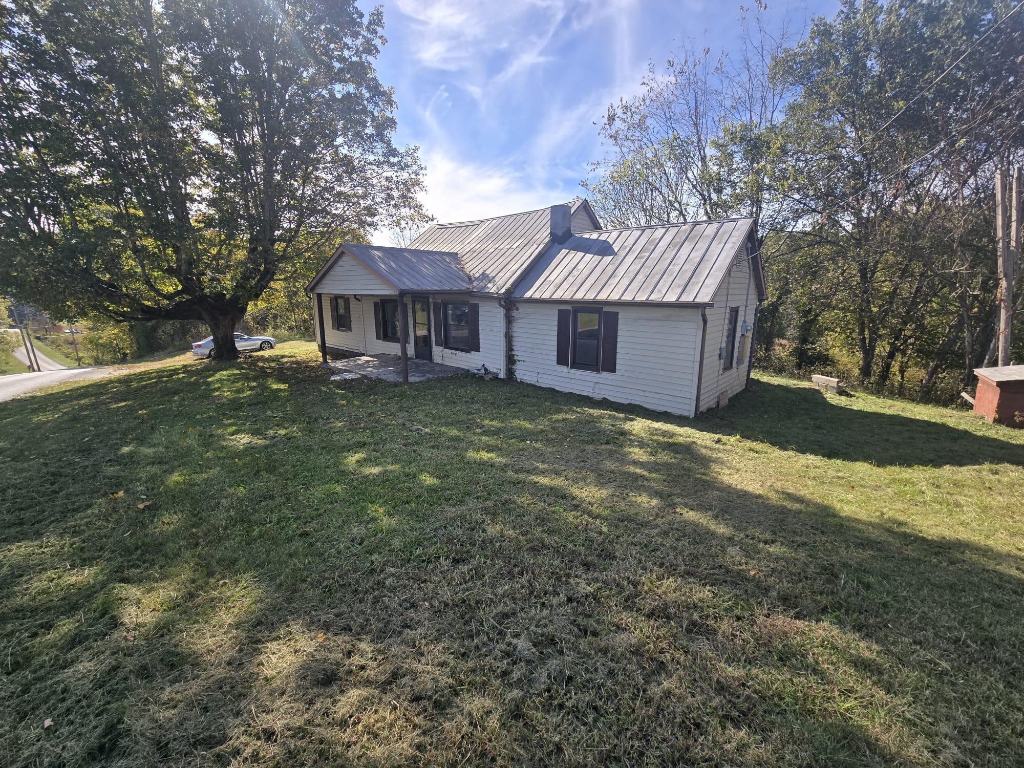 1596 Volunteer Road Rutledge, TN 37861 - Photo 13 of 25 a view of a house with a yard