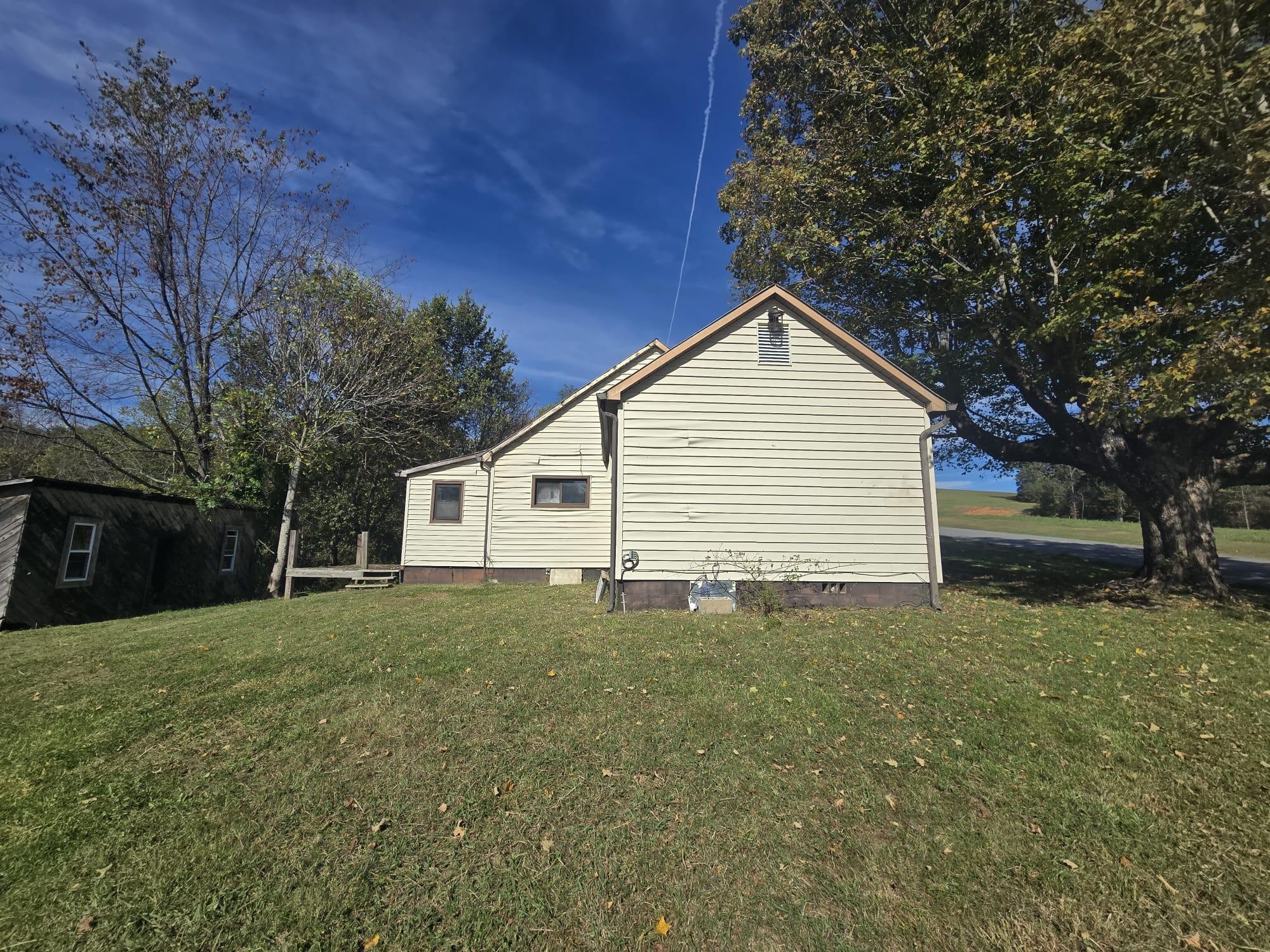 1596 Volunteer Road Rutledge, TN 37861 - Photo 20 of 25 a front view of house with yard and trees