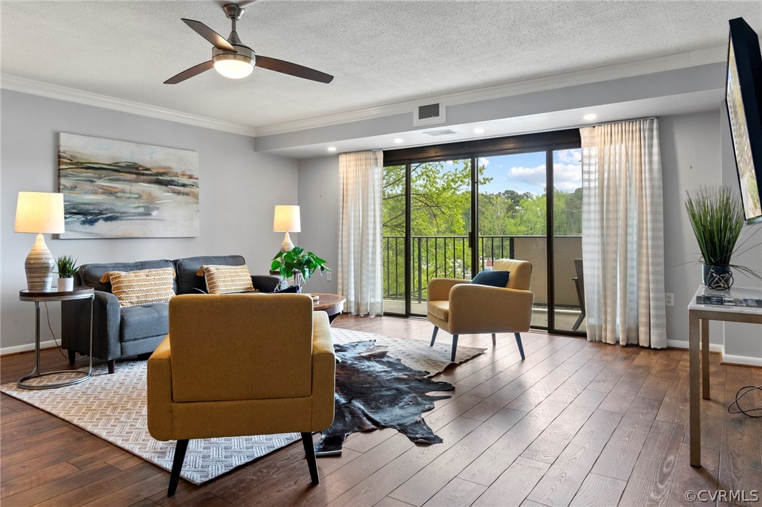 Living room with ceiling fan, recessed lighting, b