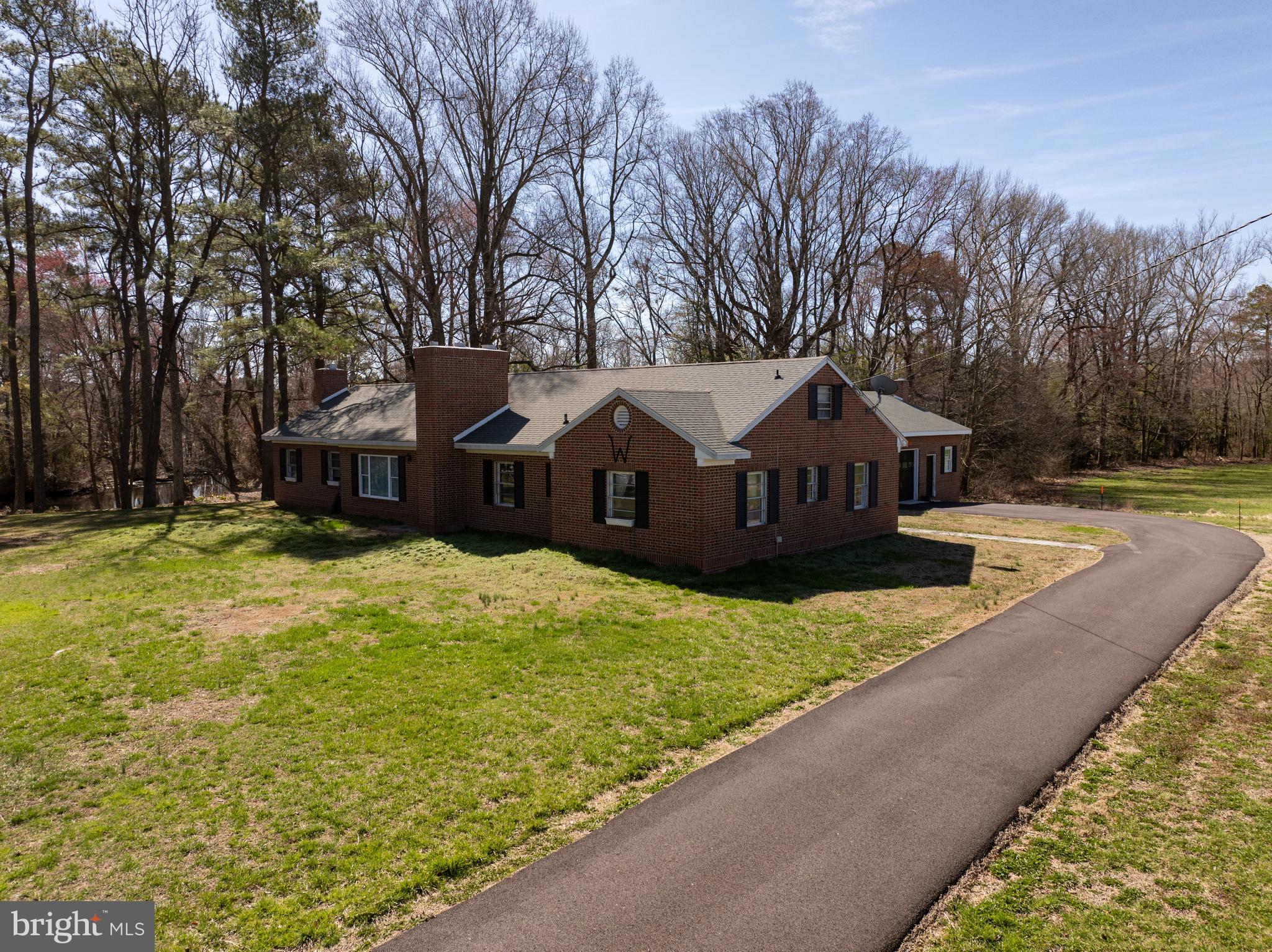 7890 Athol Road Hebron, MD 21830 - Photo 6 of 43 a front view of a house with a yard