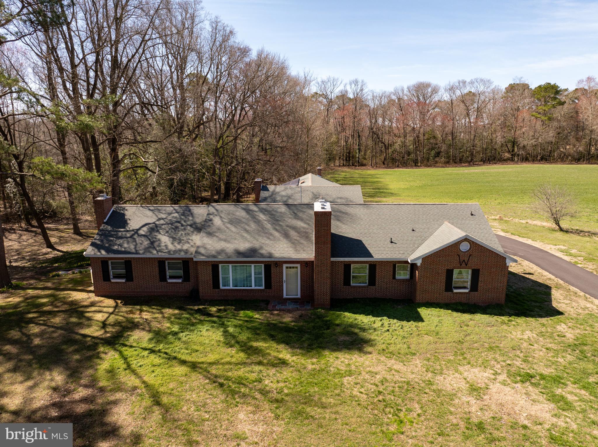 7890 Athol Road Hebron, MD 21830 - Photo 7 of 43 a view of a house with a yard and a large tree