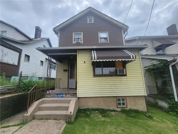 a front view of a house with a yard