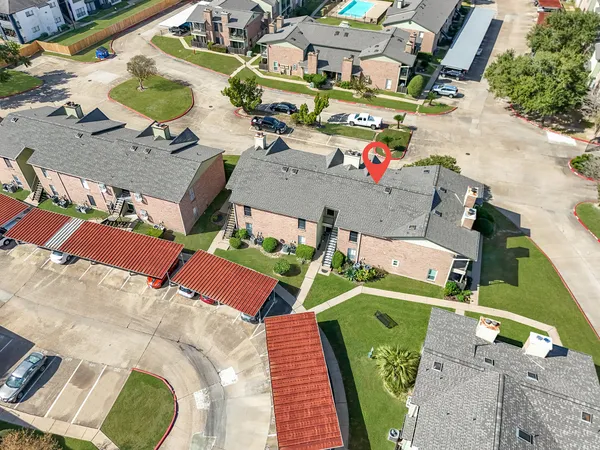 an aerial view of a houses with outdoor space