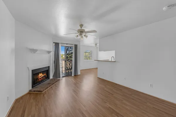 wooden floor in an empty room with a fireplace