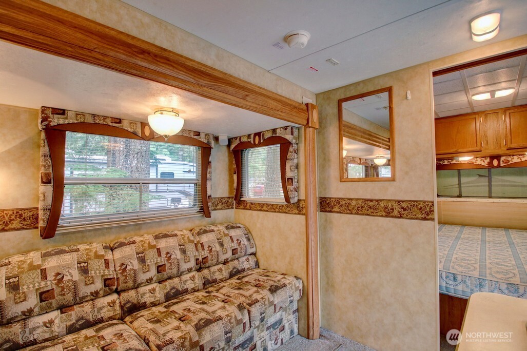 61 Christmas Tree Circle Maple Falls, WA 98266 - Photo 12 of 34 a view of a bedroom with wooden floor and a window