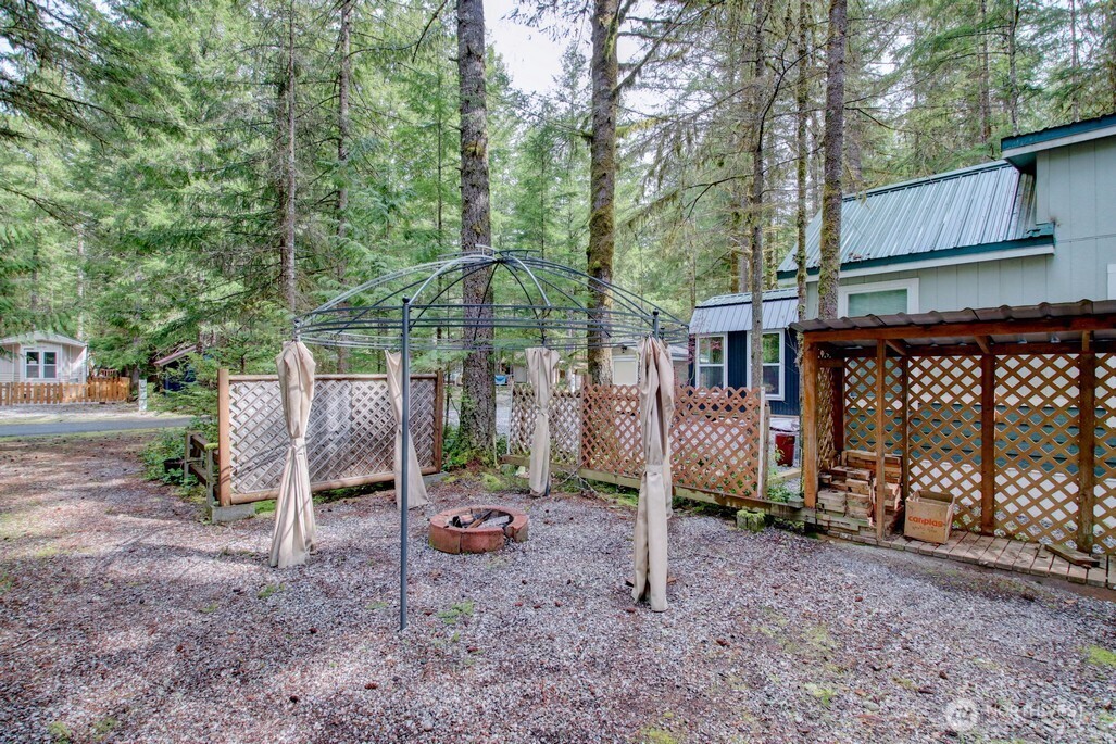 61 Christmas Tree Circle Maple Falls, WA 98266 - Photo 19 of 34 a backyard of a house with barbeque oven and a table
