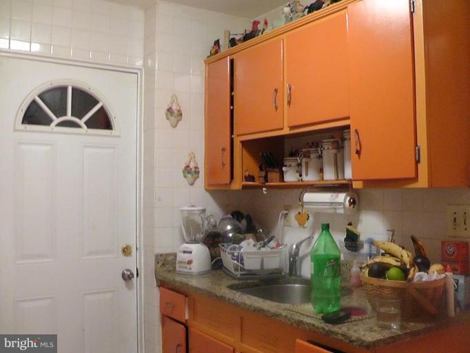 12106 Goodhill Road Silver Spring, MD 20902 - Photo 5 of 18 a kitchen with a sink and cabinets