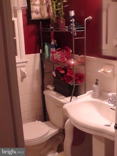 12106 Goodhill Road Silver Spring, MD 20902 - Photo 7 of 18 a bathroom with a sink a toilet and a mirror