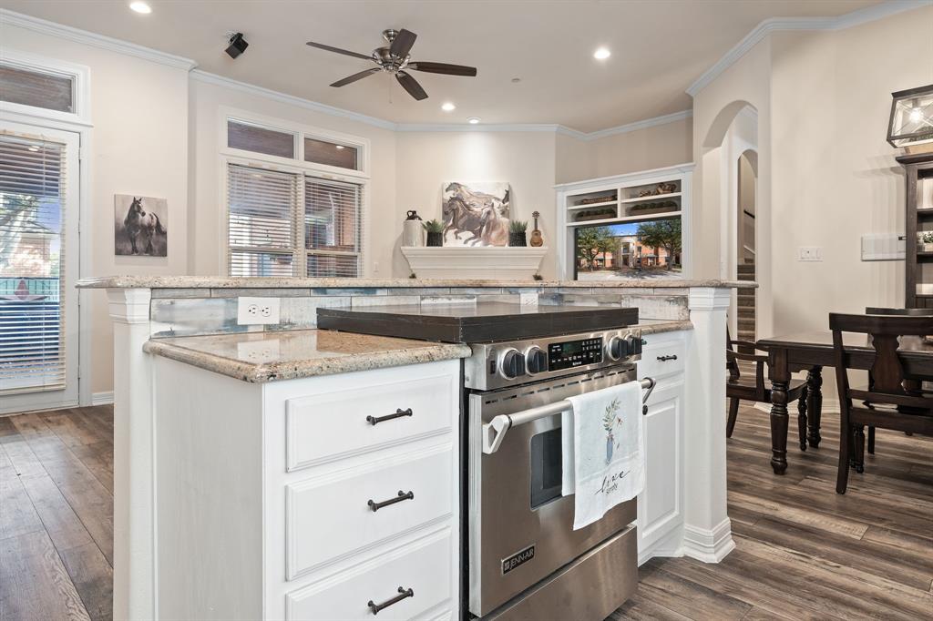 8444 Library Street Frisco, TX 75034 - Photo 14 of 36 a kitchen with stainless steel appliances granite countertop a stove and a sink