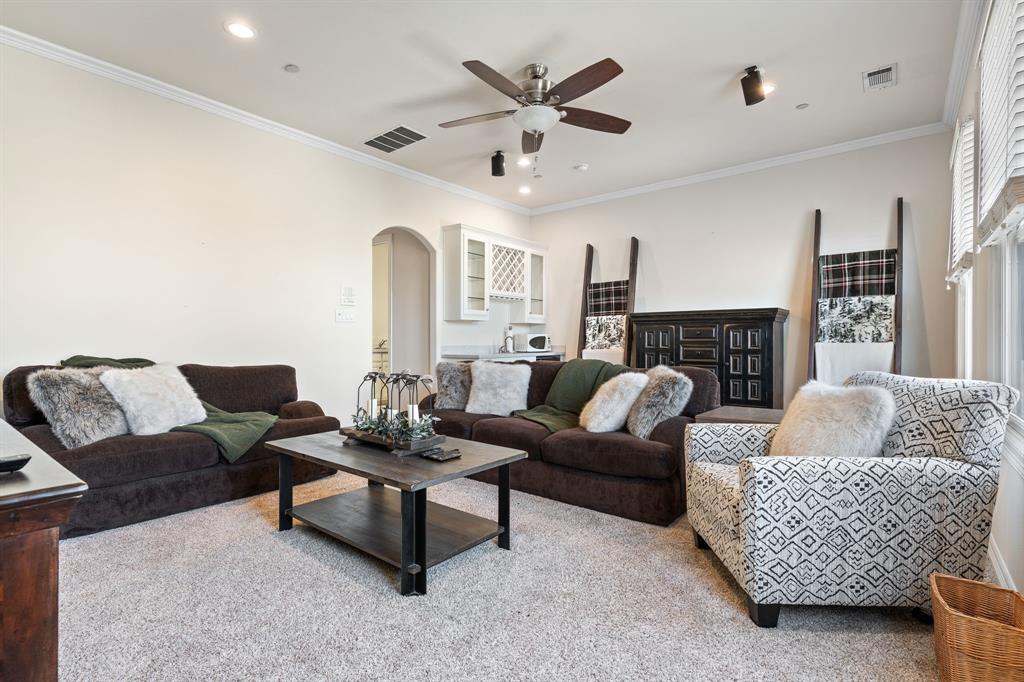 8444 Library Street Frisco, TX 75034 - Photo 16 of 36 a living room with furniture and a fireplace