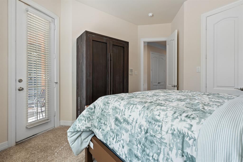 8444 Library Street Frisco, TX 75034 - Photo 23 of 36 a bedroom with a bed and a window