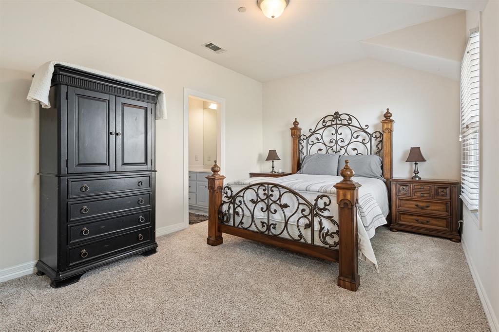 8444 Library Street Frisco, TX 75034 - Photo 30 of 36 a bedroom with a bed and a cabinets