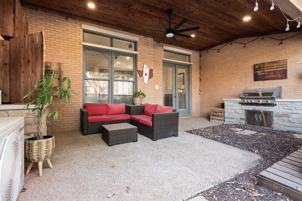 8444 Library Street Frisco, TX 75034 - Photo 35 of 36 a living room with furniture and a flat screen tv