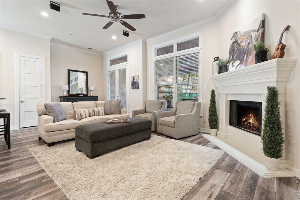 8444 Library Street Frisco, TX 75034 - Photo 9 of 36 a living room with furniture and a fireplace