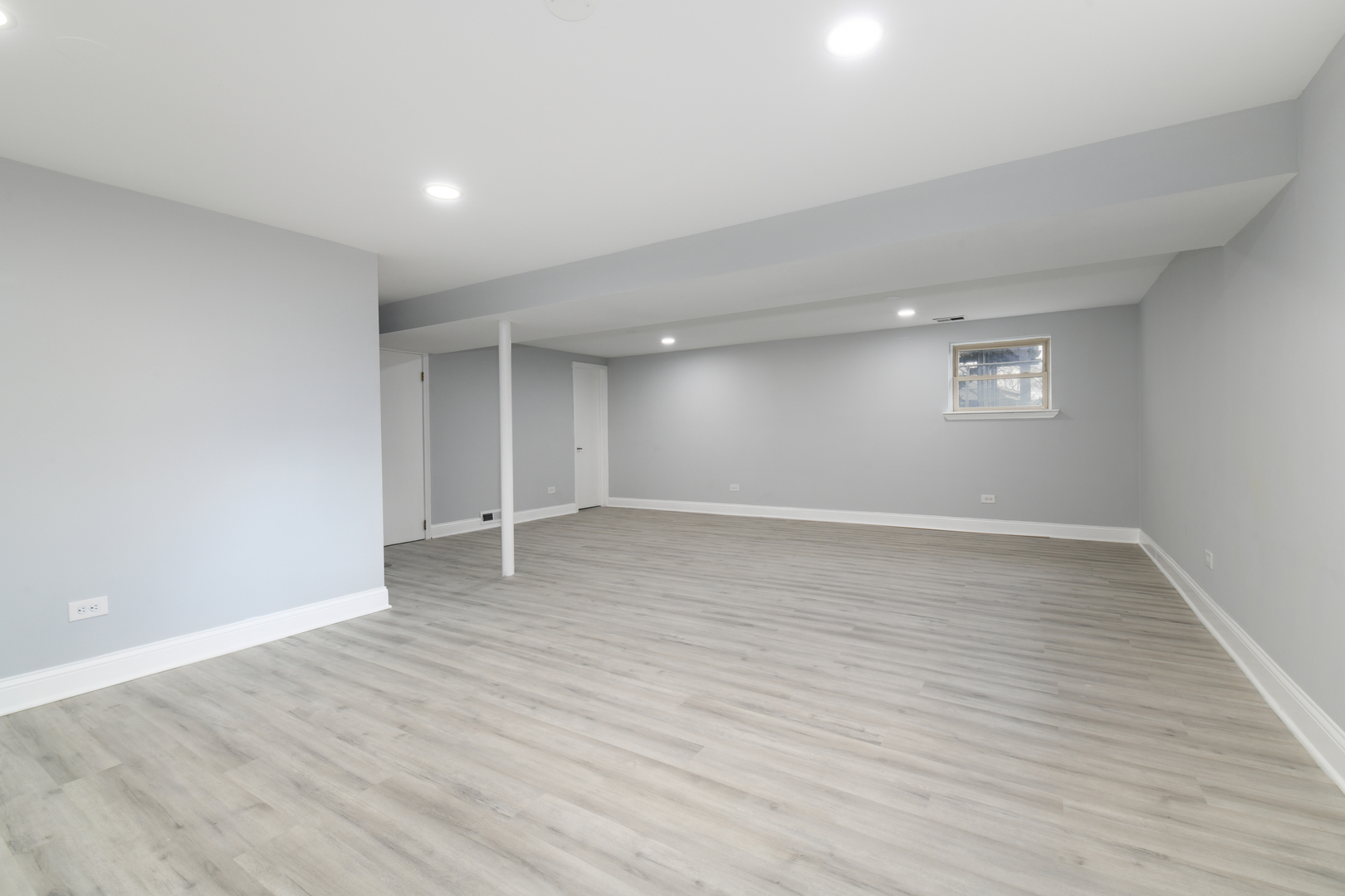 44 Redwood Trail Wheeling, IL 60090 - Photo 13 of 18 a view of an empty room with wooden floor and a window