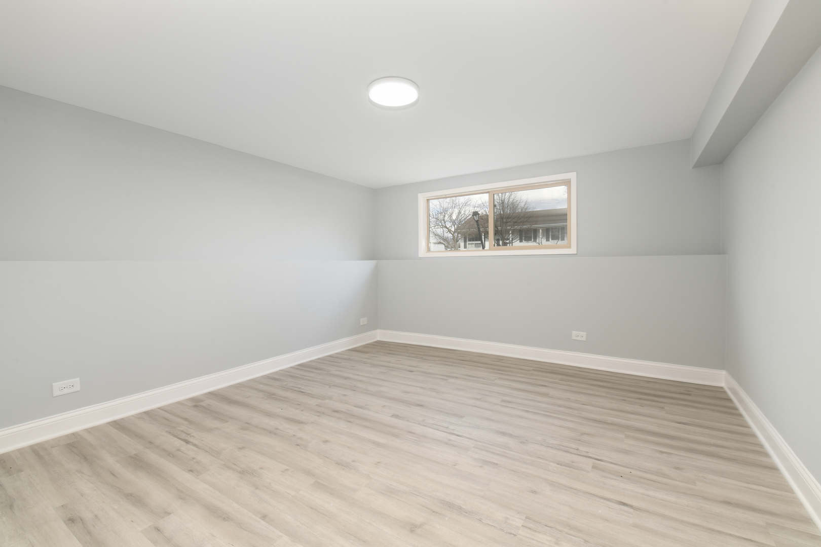 44 Redwood Trail Wheeling, IL 60090 - Photo 15 of 18 wooden floor in an empty room with a window